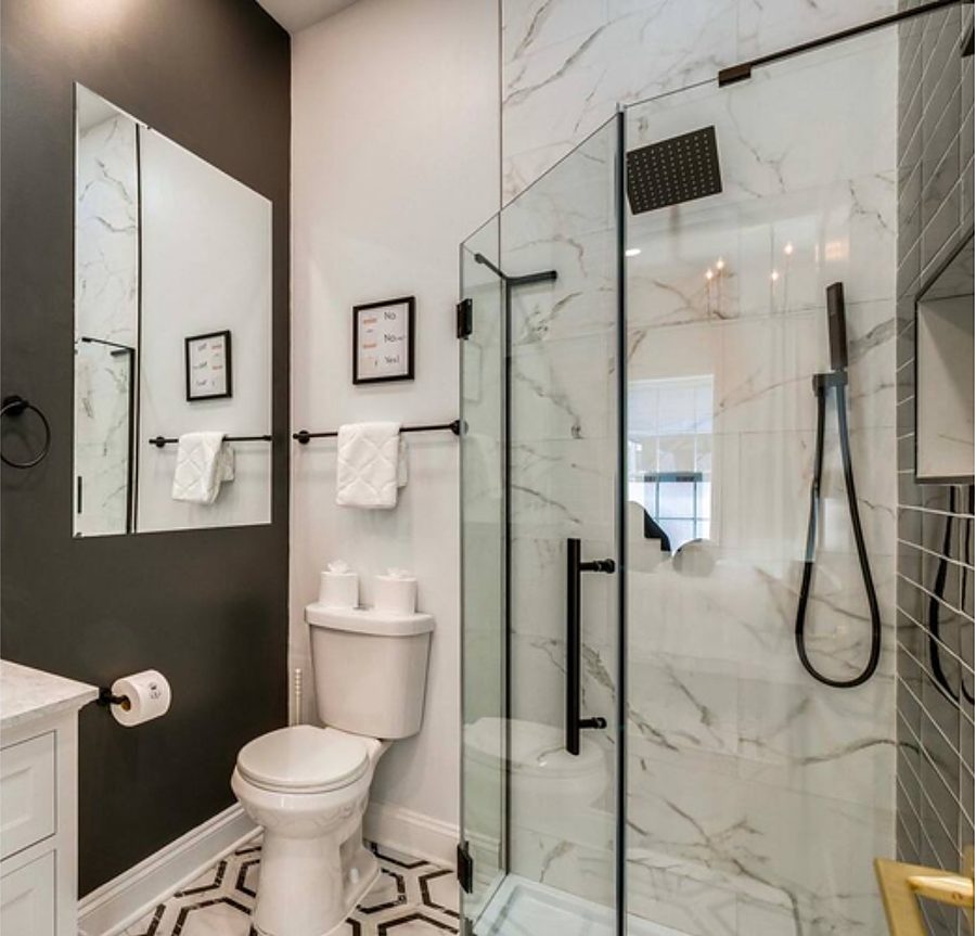 Moody Black & Marble Bath — Bathrooms by DFC Home Improvement