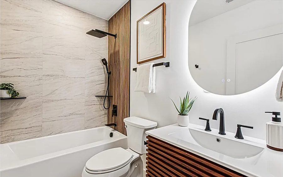 Warm Marble & Brass Bath — Bathrooms by DFC Home Improvement