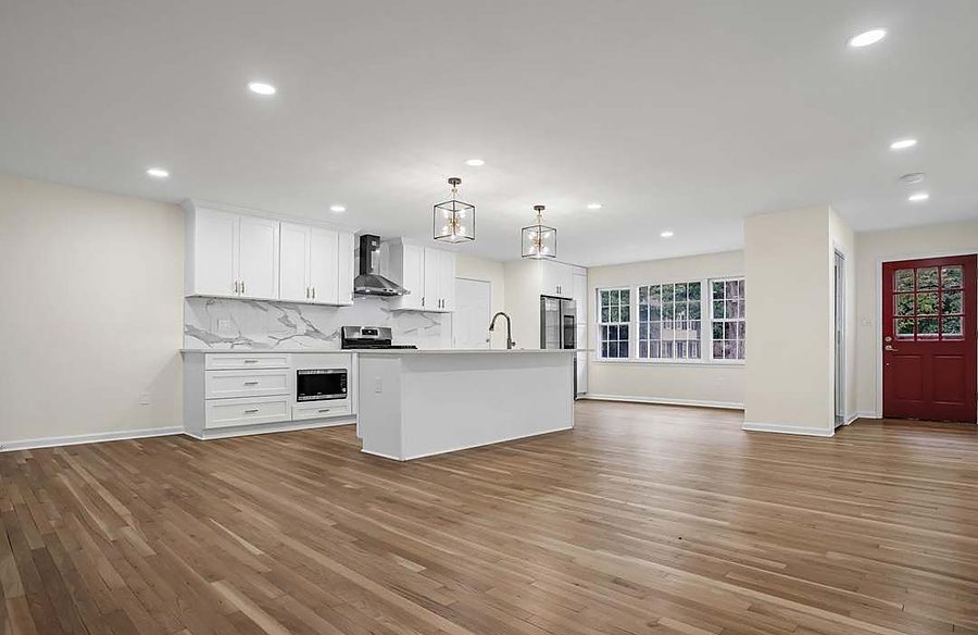 Open-Concept White Kitchen — Kitchens by DFC Home Improvement
