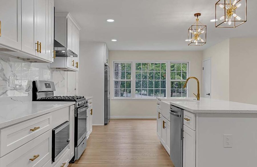 Open-Concept White Kitchen — Kitchens by DFC Home Improvement
