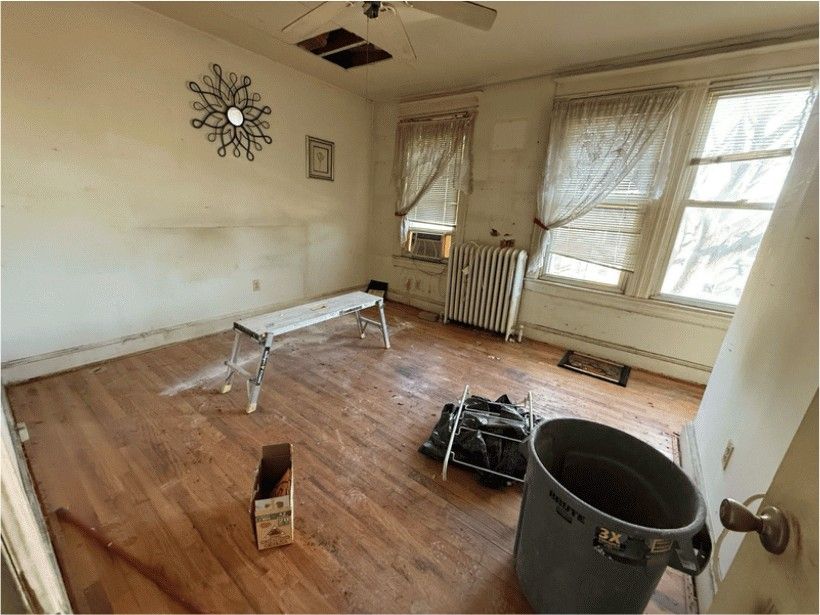 Open-Concept Great Room — before renovation by DFC Home Improvement
