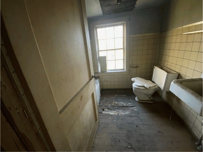 Arched-Mirror Spa Bath — before renovation by DFC Home Improvement