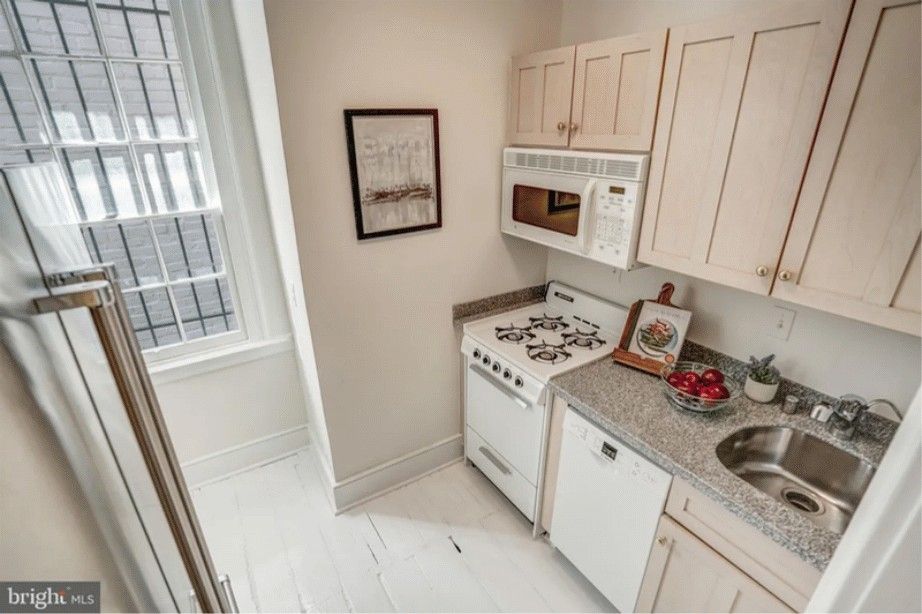 Marble & Brass Kitchen — before renovation by DFC Home Improvement